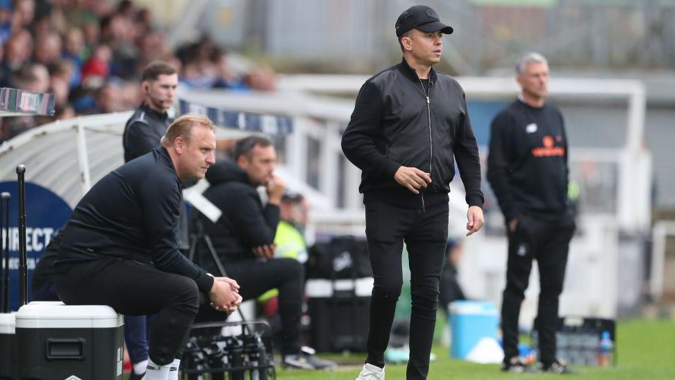 Marc White managing on the sidelines