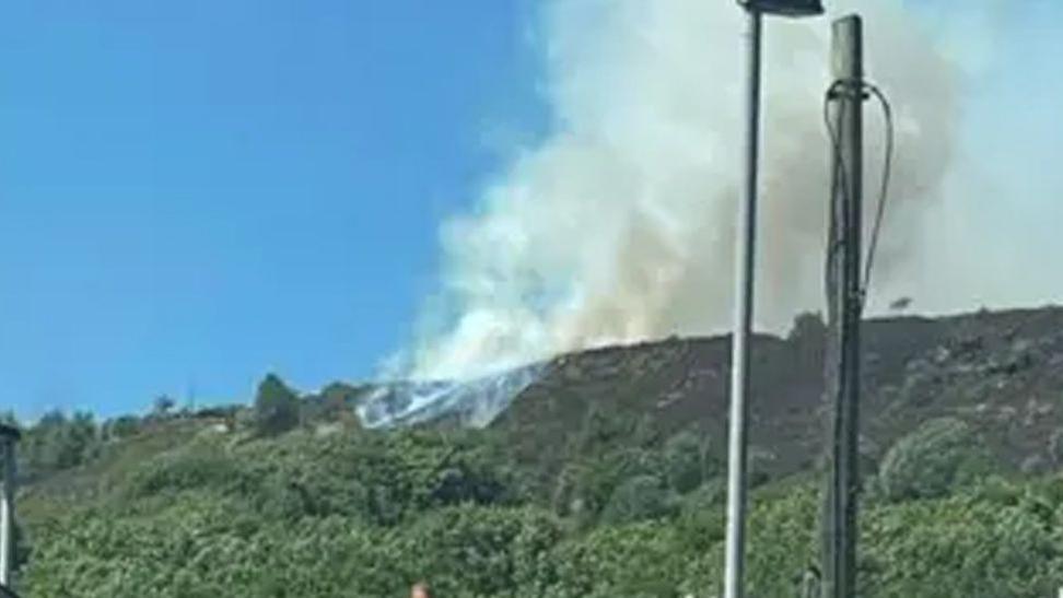 A large plume of smoke on Holcombe Hill