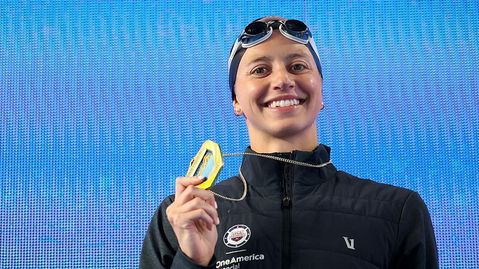 Kate Douglass celebrates after winning gold in the women's 50m freestyle at the Pan Pacific Swimming Championships in Irvine, California.