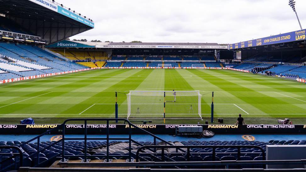 A view from the stands of Leeds United's football ground at Elland Road. The seats are in the club's colours of blue and yellow.