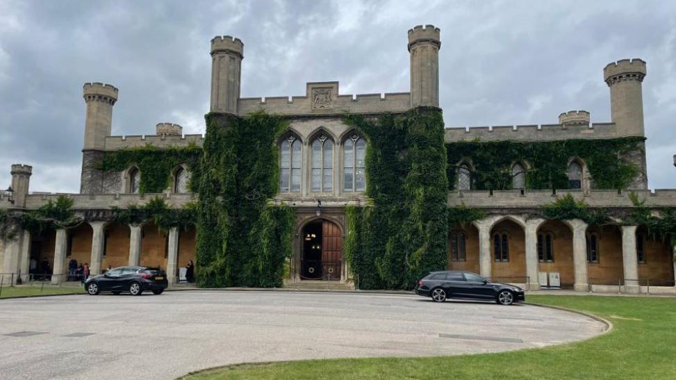 Lincoln Crown Court an old building with grass on the walls, columns and turrets