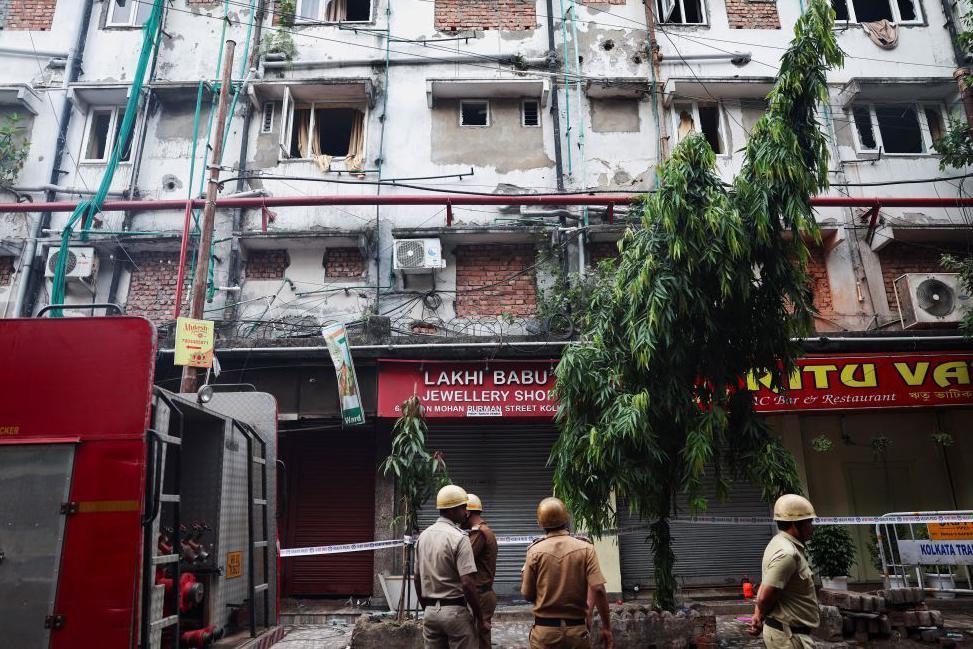 Firefighters inspect the aftermath of a hotel fire that killed several people in Kolkata, India, April 30, 2025. REUTERS/Sahiba Chawdhary