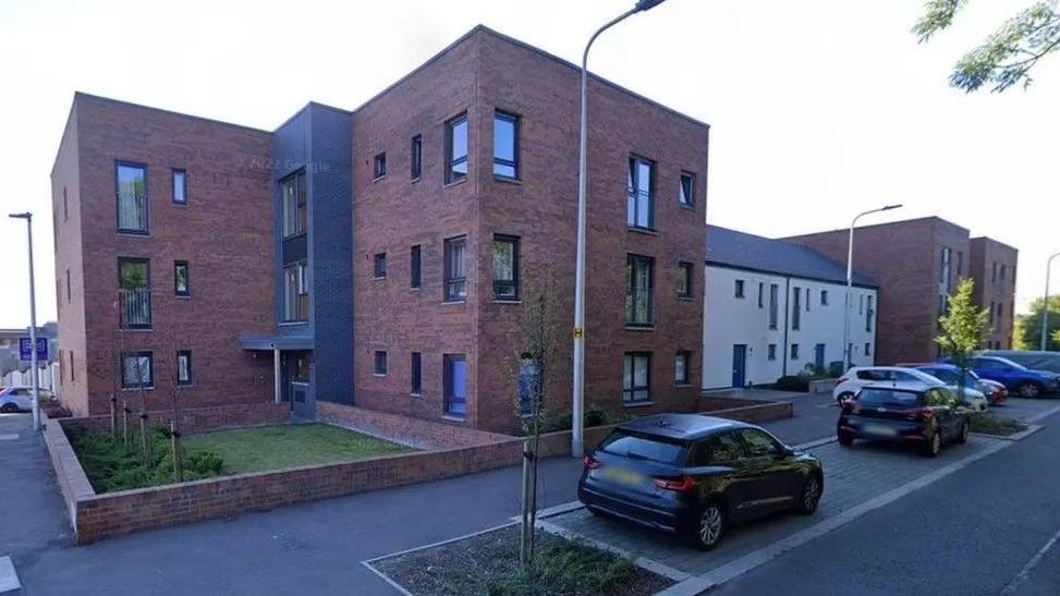 Block of flats on a residential street.