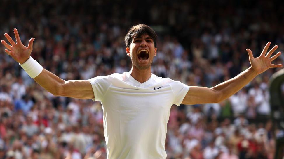 Carlos Alcaraz celebrates winning the Wimbledon title