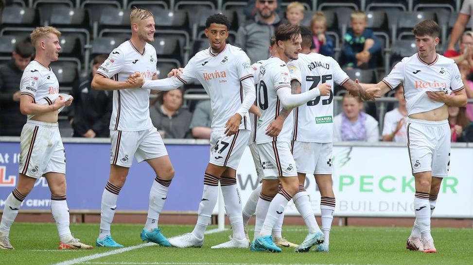 Swansea players celebrate Azeem Abdulai's goal against Preston 