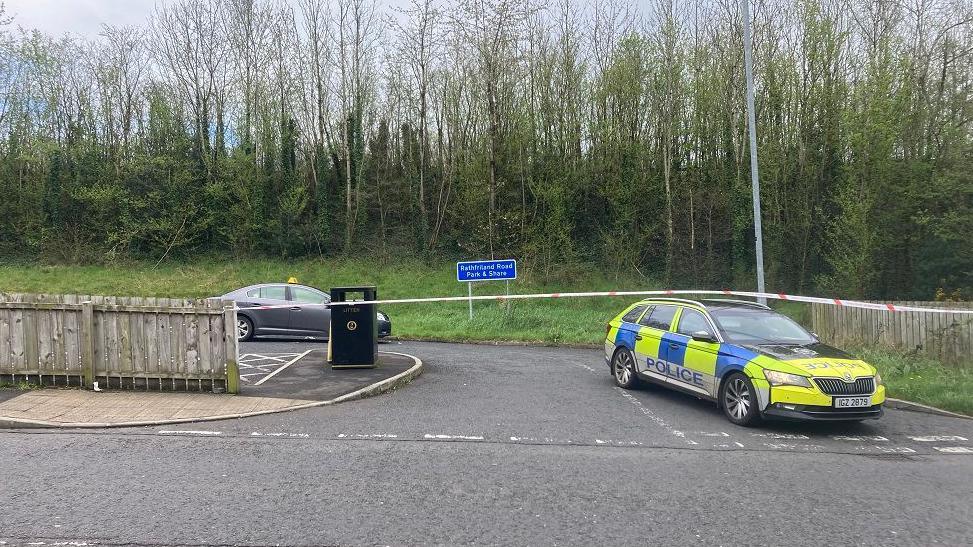 Police car at scene of shooting in April 