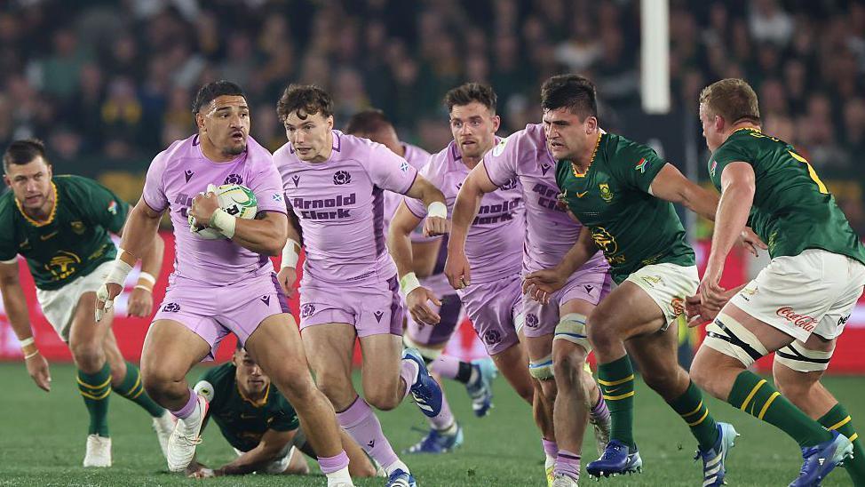 Scotland captain Sione Tuipulotu breaks with the ball against South Africa 