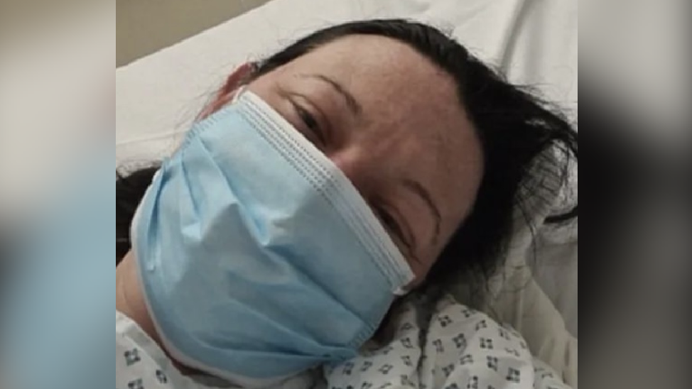 Shelly in hospital with a mask on 