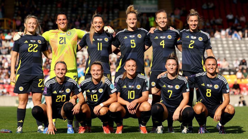 The Scotland squad pose for a team photo before a match.