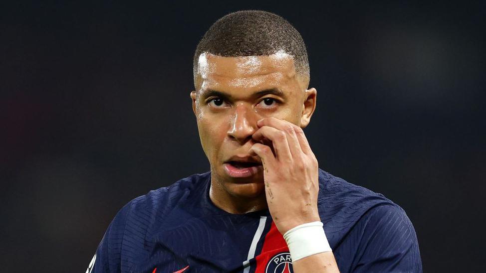 Paris St-Germain striker Kylian Mbappe looks emotional after their Champions League exit to Borussia Dortmund 