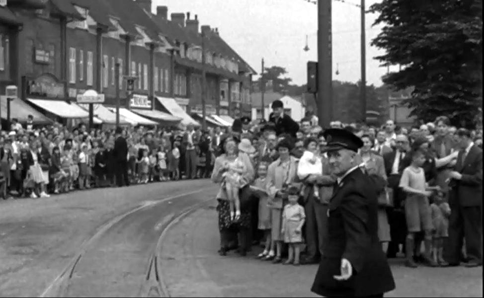 people waiting for a tram