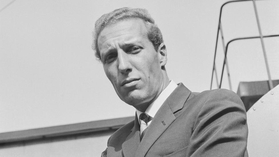 Frederick Forsyth is seen in a black and white photo from around the time he was a pilot in his 20s.