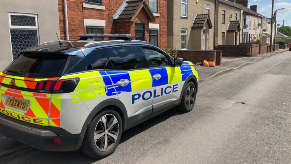 Police at the scene in Addison Street, Tibshelf