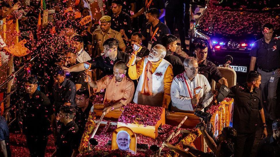 PM Narendra Modi along with UP Chief Minister Yogi Adityanath at an election roadshow in Varanasi 