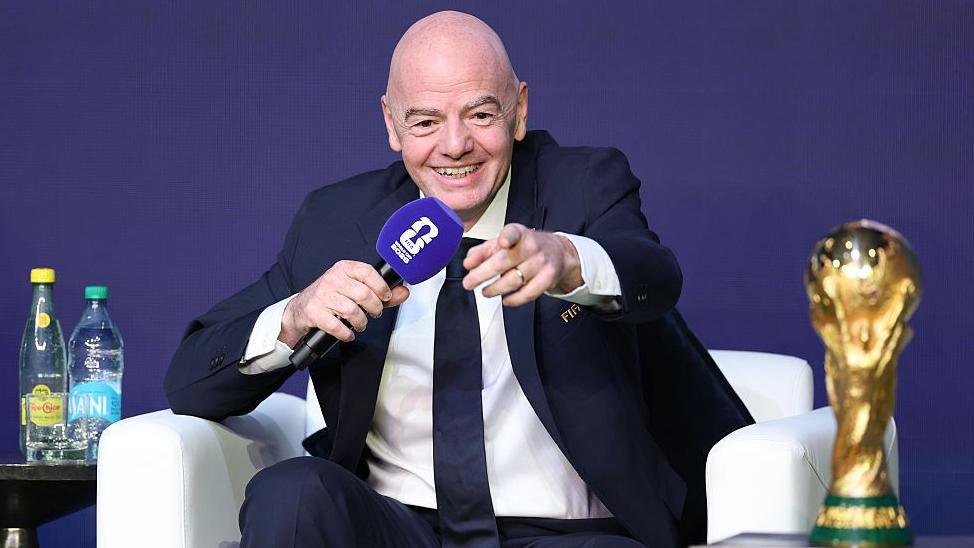 Fifa president Gianni Infantino speaking into a microphone during the Fifa World Cup 2026 official match schedule announcement