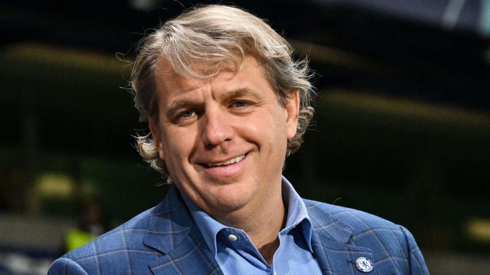 Todd Boehly with a Chelsea badge on his jacket lapel