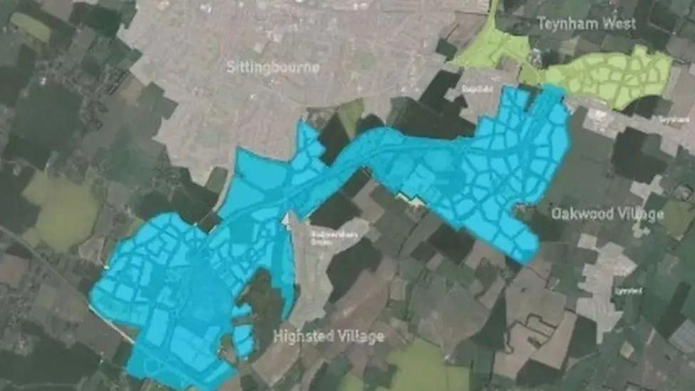 An aerial map showing the area south of Sittingbourne. There is an area highlighted in blue which shows where a new housing development would go