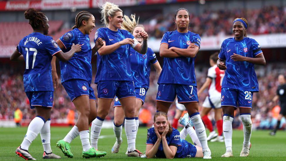 Chelsea players celebrate in front of Arsenal fans at the Emirates