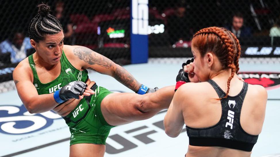 Puja Tomar aims a kick at Rayanne dos Santos in a UFC fight