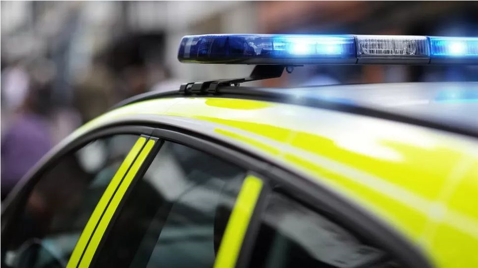 Top of police car with sirens on blue light