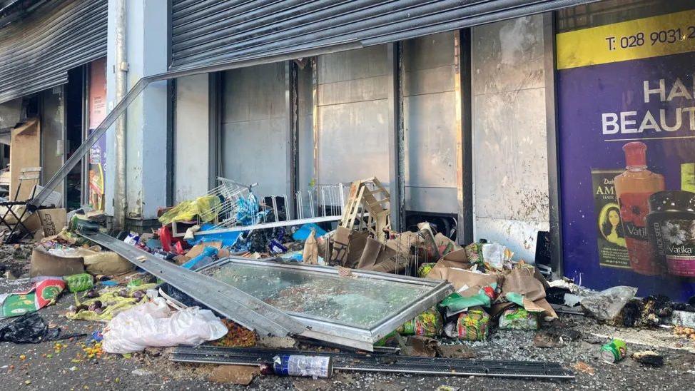 Smashed debris outside shops in Belfast