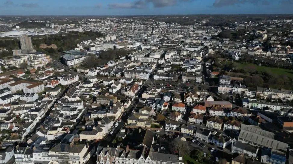 Streets, houses and rooftops in Jersey as seen from above.