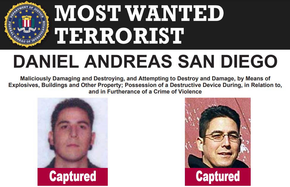 FBI poster announcing that Daniel Andreas San Diego has been caught, featuring two pictures of him, one with glasses, one without, with the word "Captured" beneath each. It also describes the offences he is accused of, including damaging and destroying property