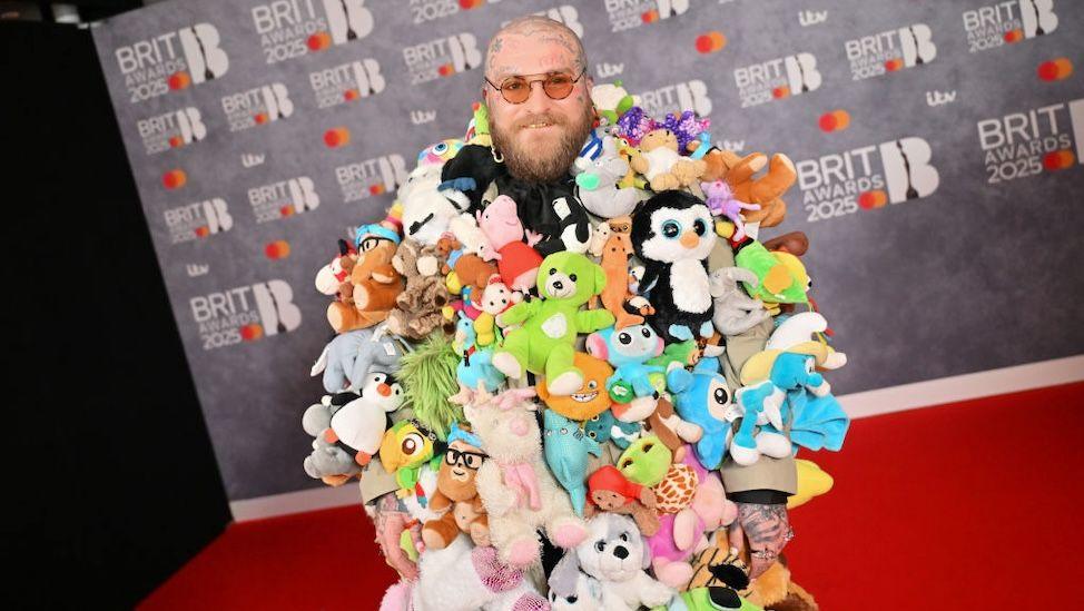 Singer Teddy Swims covered in lots of teddy bears