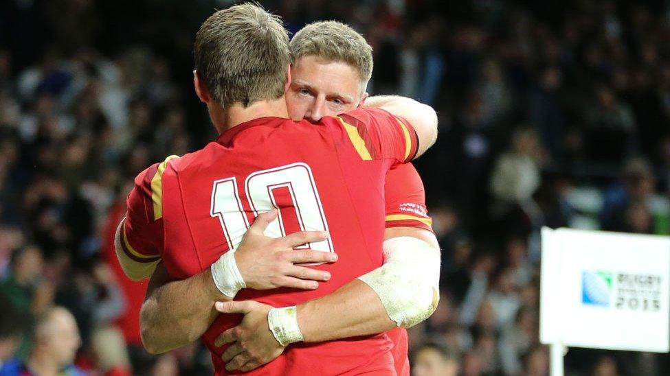 Dan Biggar and Rhys Priestland hug after Wales' win over England at Twickenham