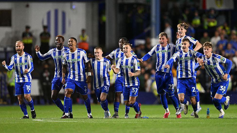 Sheffield Wednesday players celebrate after beating Leeds United on penalties in the EFL Cup