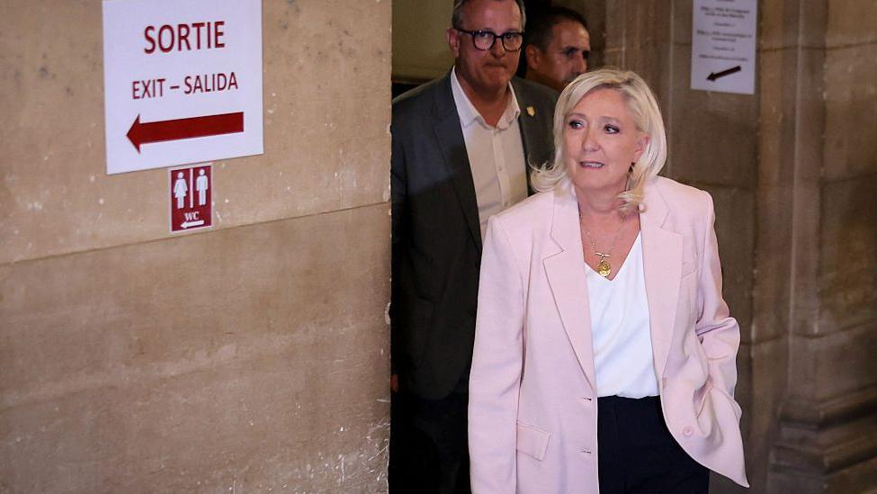 President of far-right party Rassemblement National (RN) parliamentary group Marine Le Pen arrives to attend the verdict in the appeal trial of RN former or actual members on charges of embezzlement