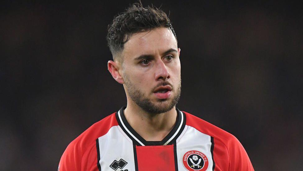 George Baldock playing for Sheffield United in the Premier League