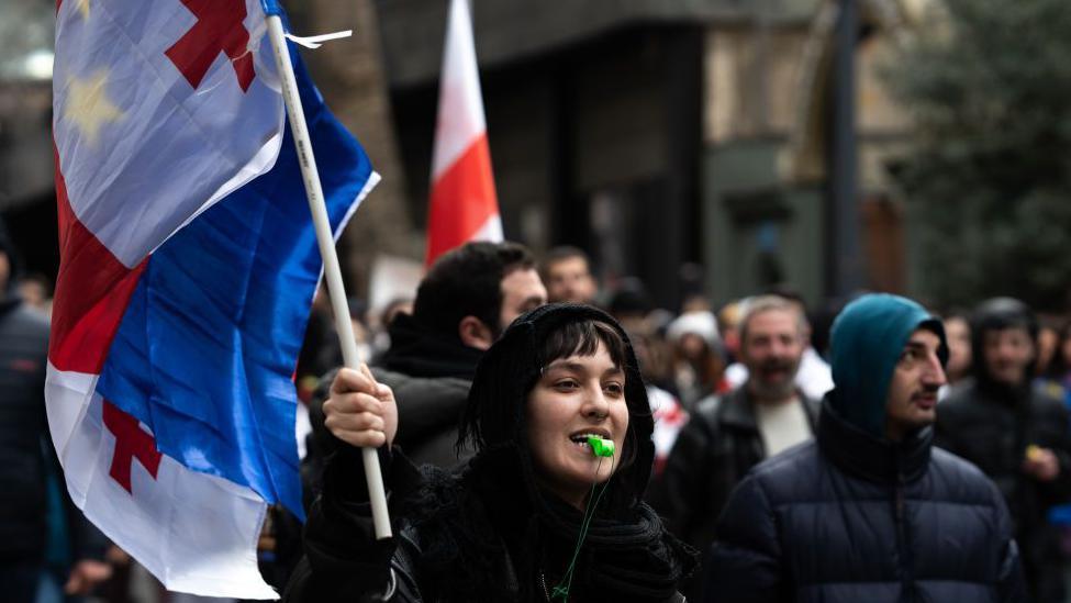 Private sector workers and students take to the streets on a 16th day of protests in Georgia