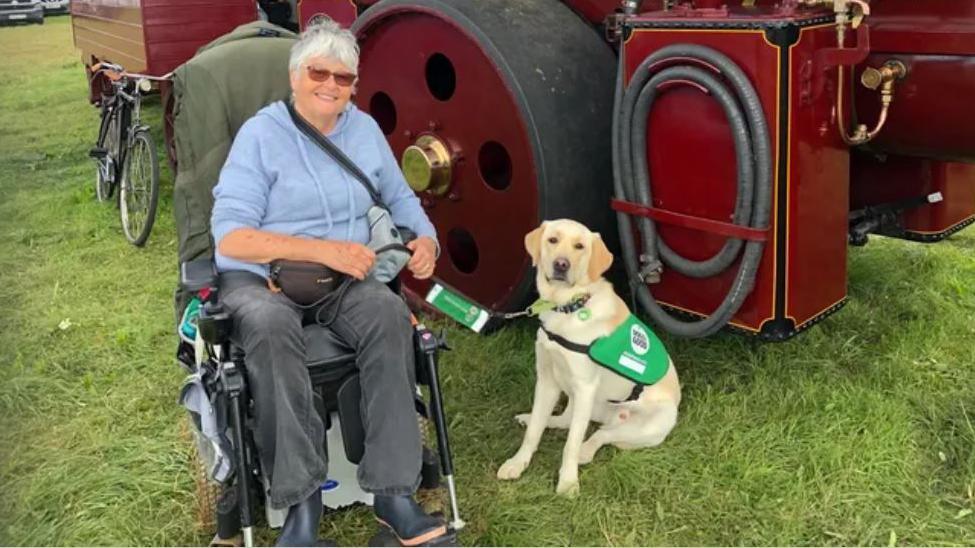 Mary Lamb with her assistance dog Sheldon