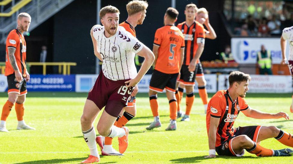 Hearts' Stuart Findlay celebrates against Dundee United