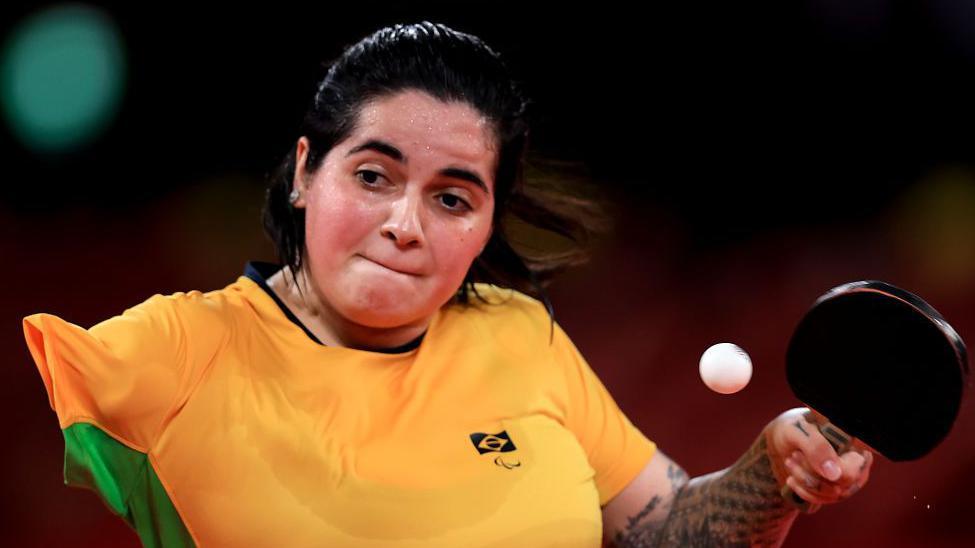 Table tennis player Bruna Alexandre plays a shot at the Tokyo Paralympics