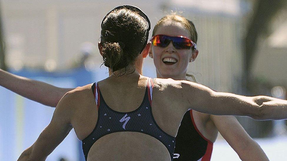 Non Stanford greets winner Gwen Jorgenson at the end of the Olympic Test triathlon in Rio