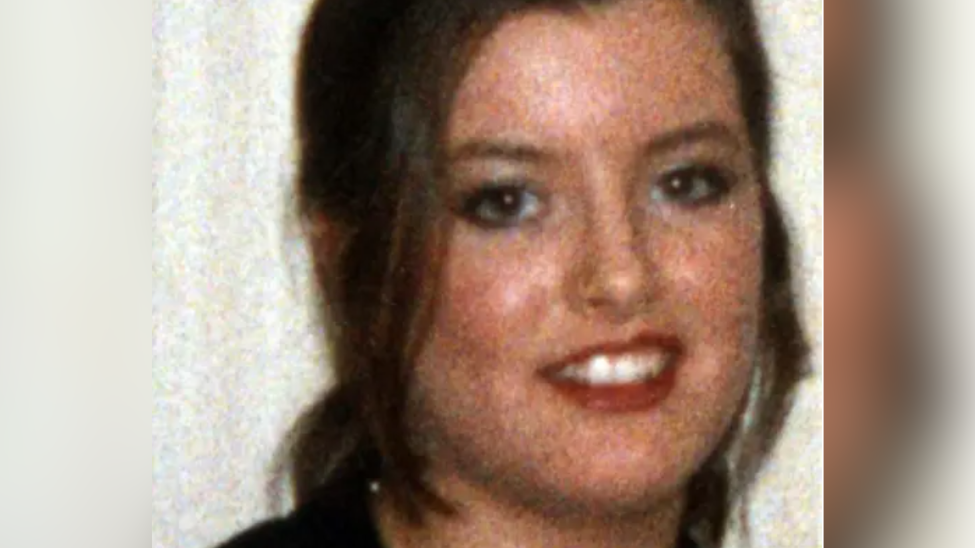 Headshot of young woman smiling at the camera