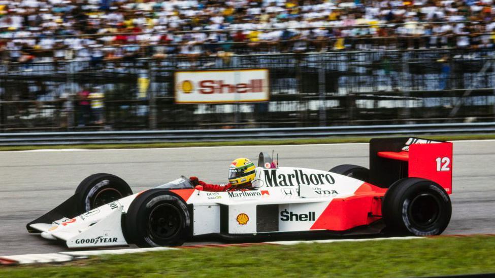 A side view of Ayrton Senna driving the McLaren MP4/4 during the 1988 Brazilian Grand Prix
