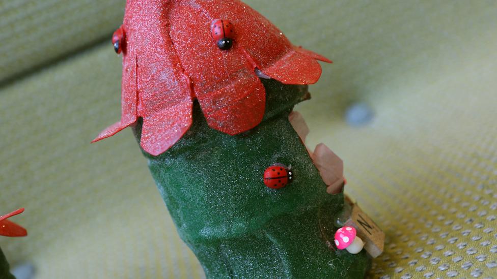 The side of one of the bird nests, showing the little decorative ladybirds.