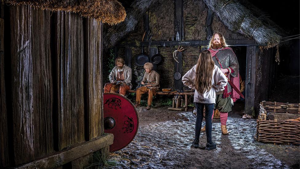 child-with-long-brown-hair-faces-up-to-a-viking.