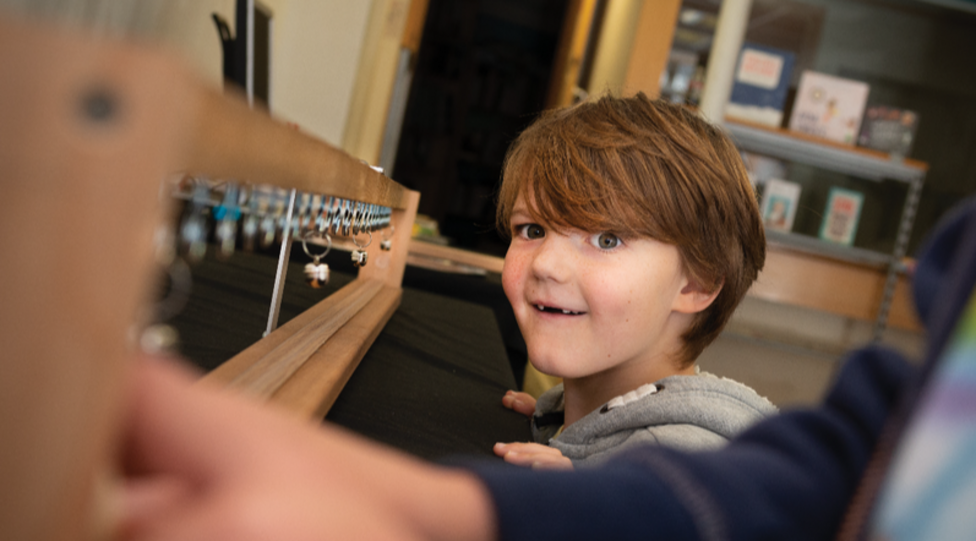 Child interacting at a museum.