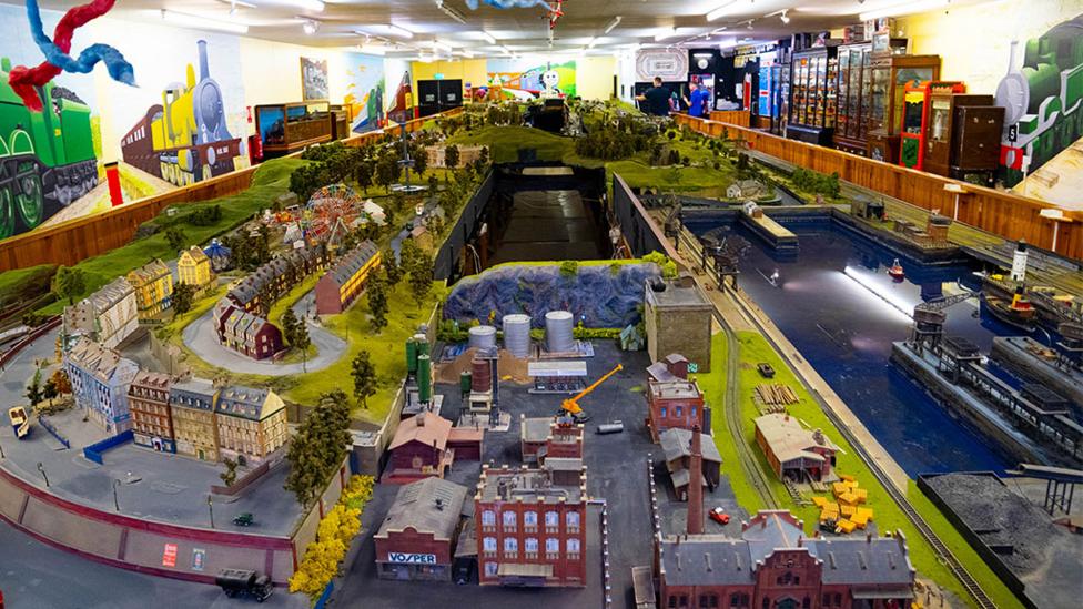 model_railway_with_tiny_people_and_buildings.