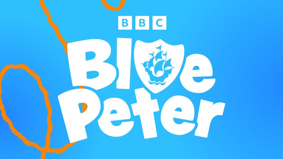 Blue Peter presenters gathered together, they are Abby, Joel, Hacker, Shini and Henry the dog.