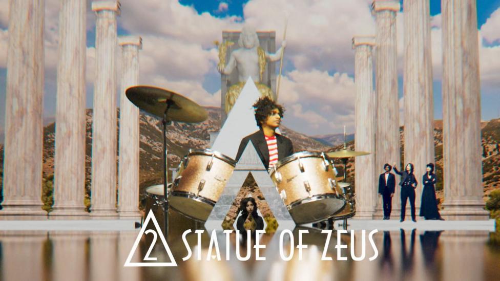 Singers next to the statue of zeus