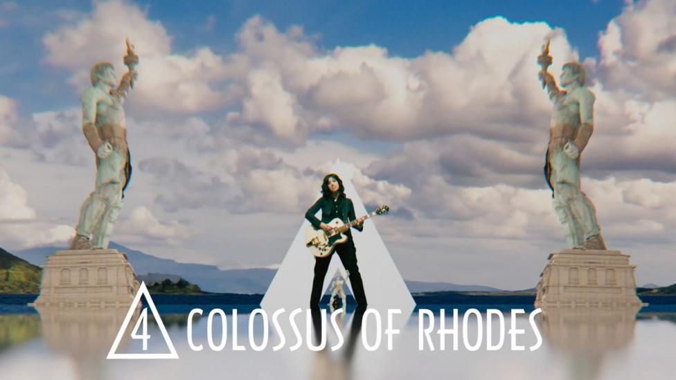 Singers next to the collosus of rhodes