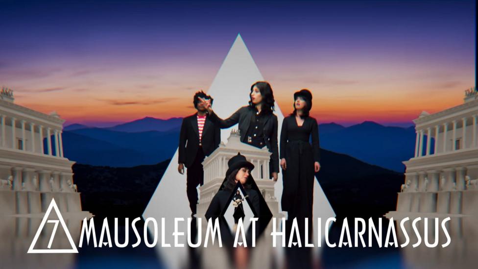 Singers next to the mausolleum of halicarnassus