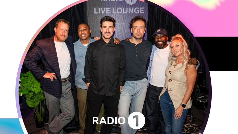 Members of band Mumford & Sons pose with Rickie, Melvin and Charlie