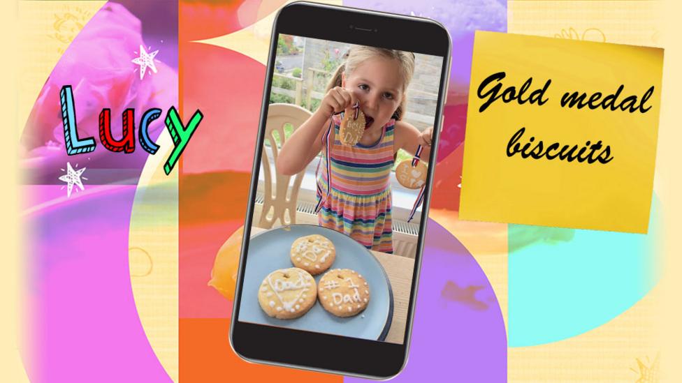 A girl shows a plate of gold medal biscuits that she has made for father's day.