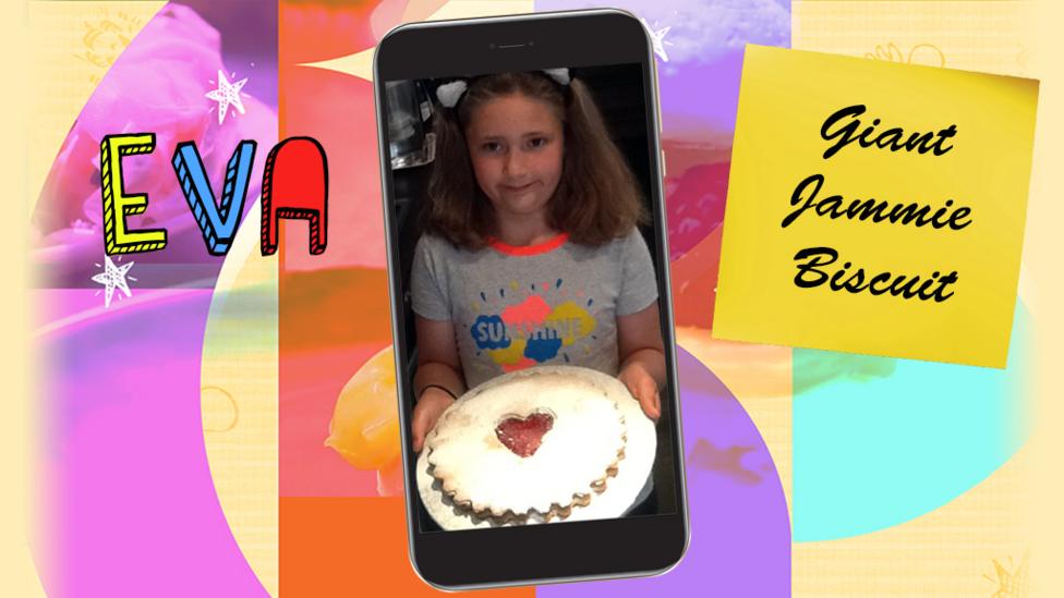 A little girl (Eva) holding a Giant Jammie Biscuit.